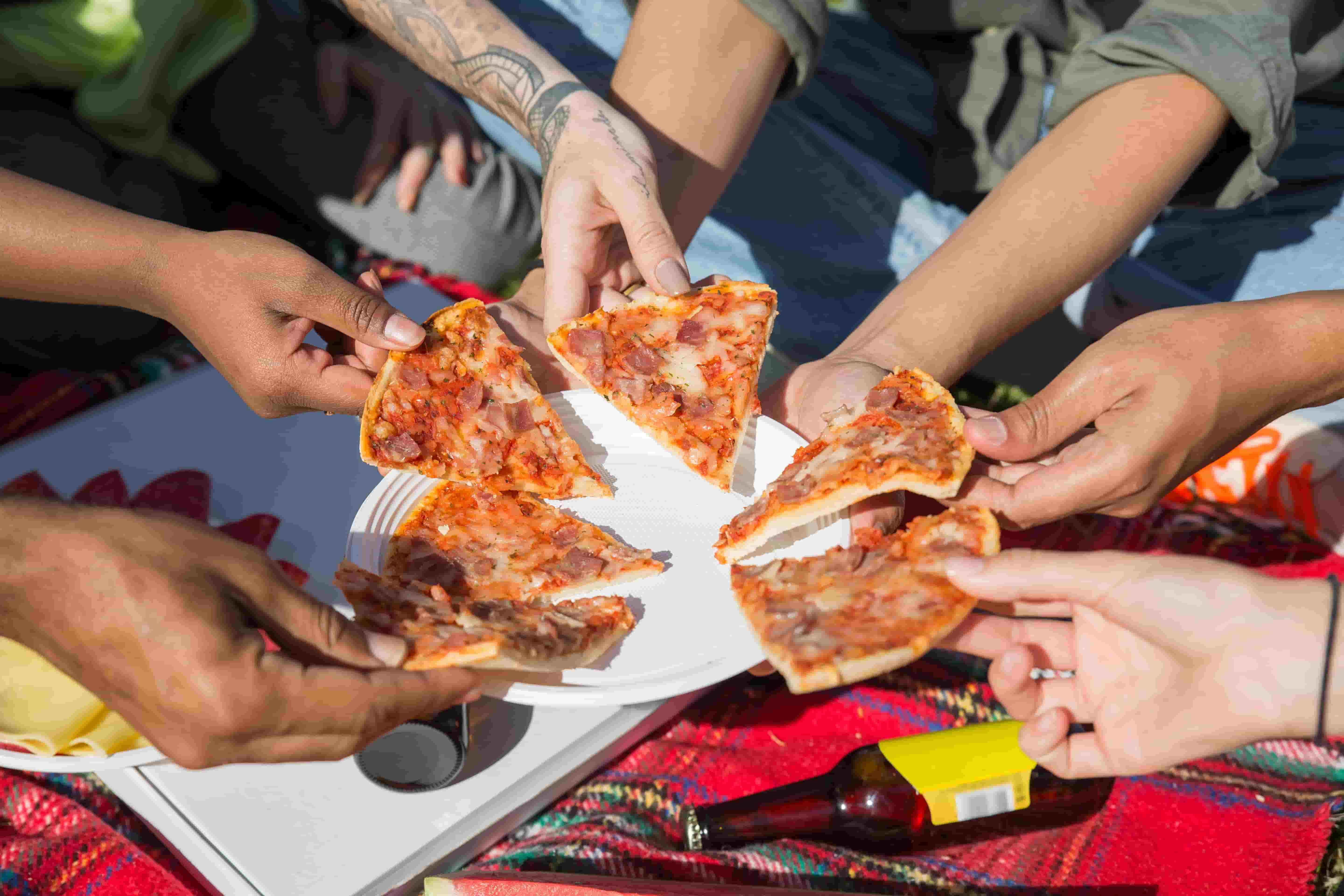 CoderDocks members sharing pizza